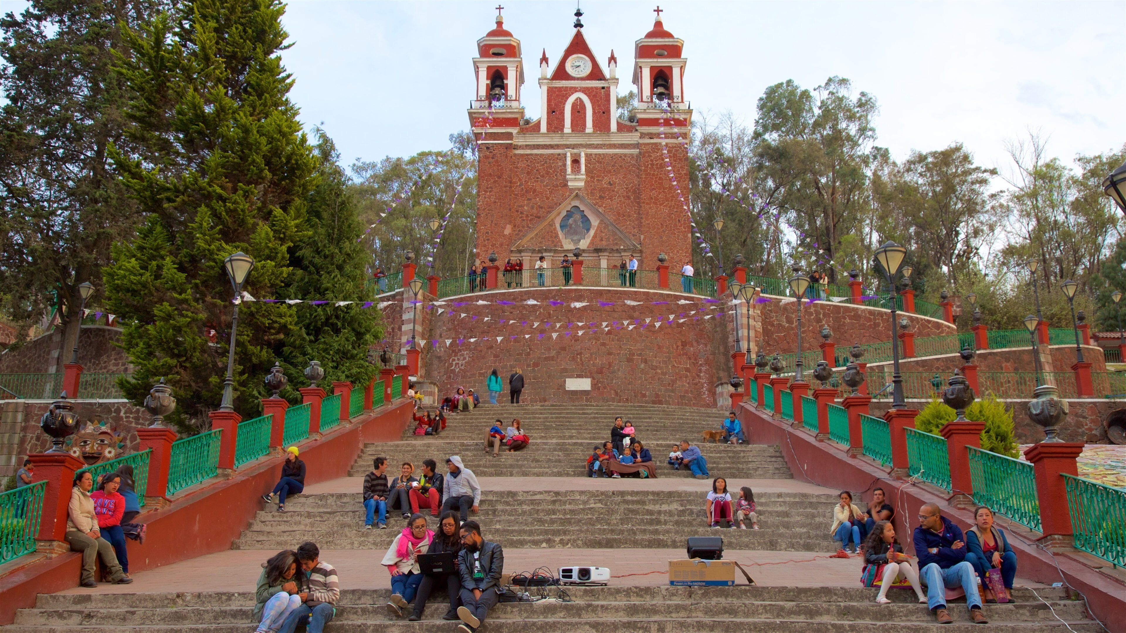 Metepec which includes a church or cathedral as well as a small group of people