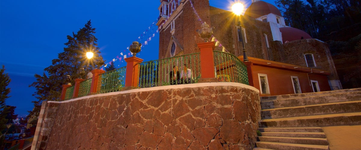 Metepec showing a church or cathedral and night scenes