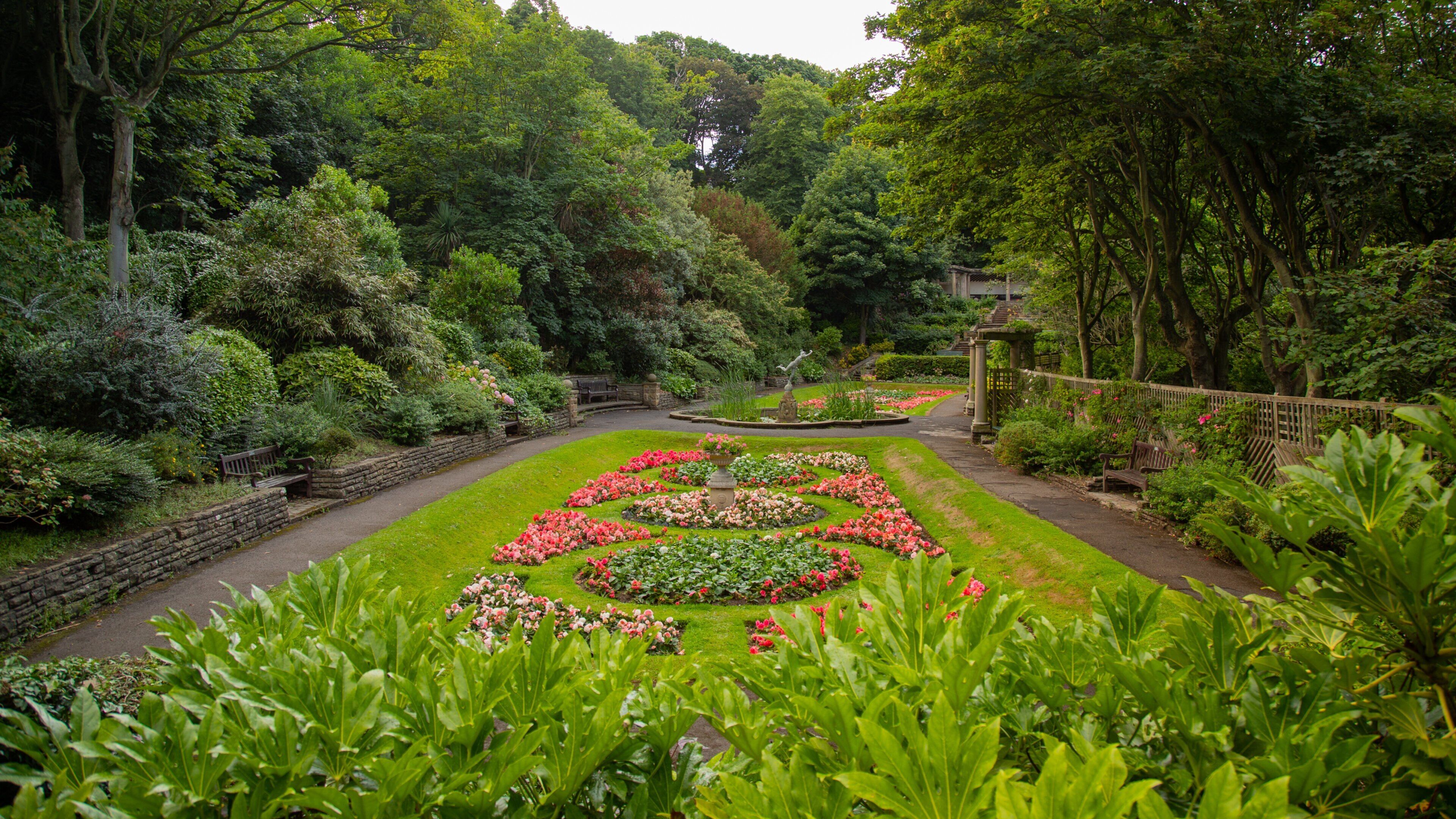South Cliff Italian Gardens featuring a garden and flowers