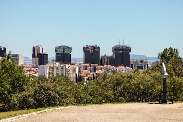 A view of Lisbon from the viewpoint of Parque Recreativo do Alto da Serafina at Monsanto Forest Park - modern buildings in the background
