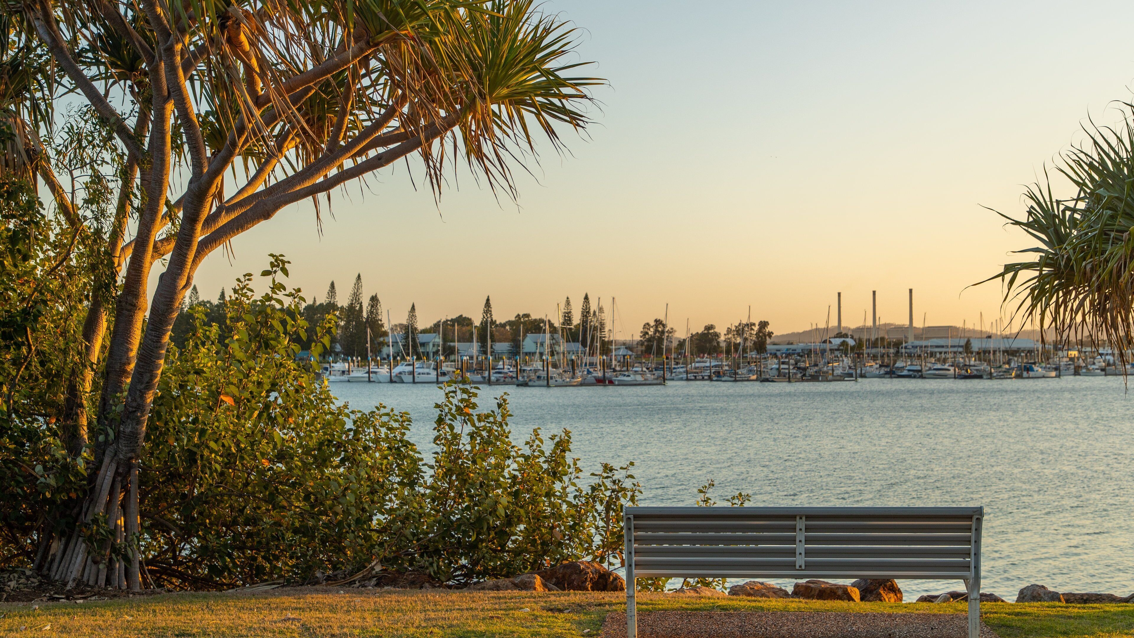 Callemondah featuring a bay or harbor, a sunset and a park