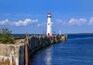 The Wawatam Lighthouse, or St. Ignace Lighthouse as it looks toward Mackinac Island in the Straits of Mackinac on a lazy Summer afternoon, Michigan, Upper Peninsula, USA; Shutterstock ID 466177430; Pu