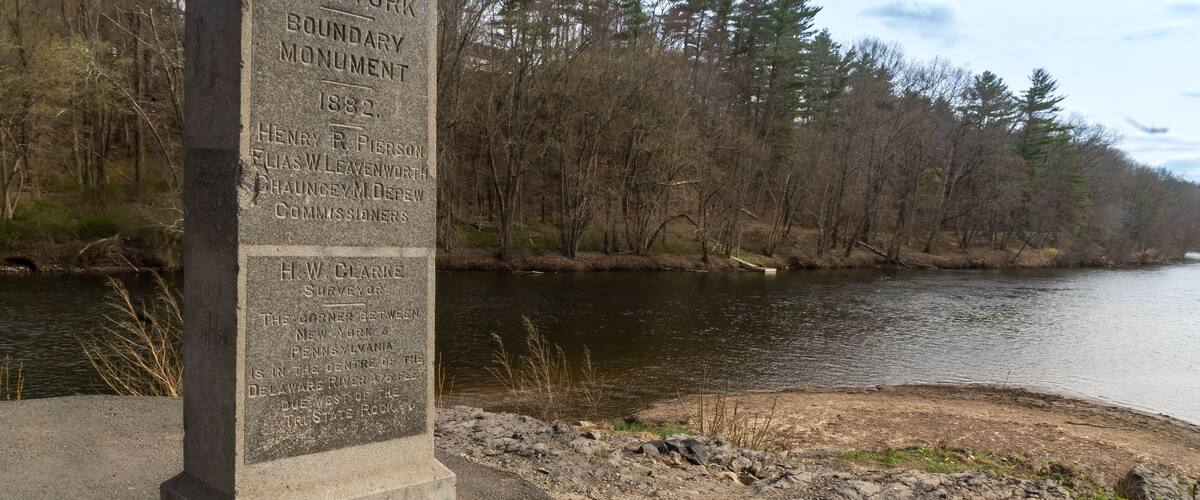 Port Jervis, NY - USA - April 10,2021: View of Witness Monument or the western State Line Monument, is a tall upright granite monument located south of the Laurel Grove Cemetery in Port Jervis, NY