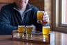 Man sampling craft beer at a restaurant
