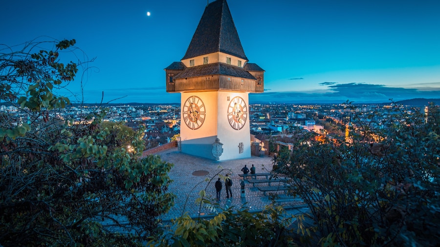 City of Graz with famous clock tower at night, Styria, Austria