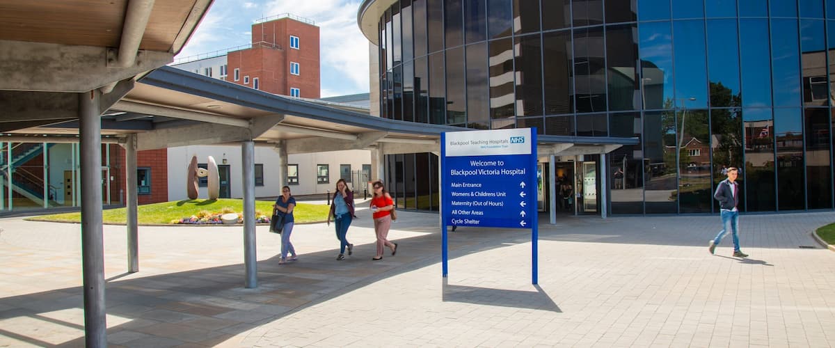 Victoria Hospital which includes signage and street scenes as well as a small group of people