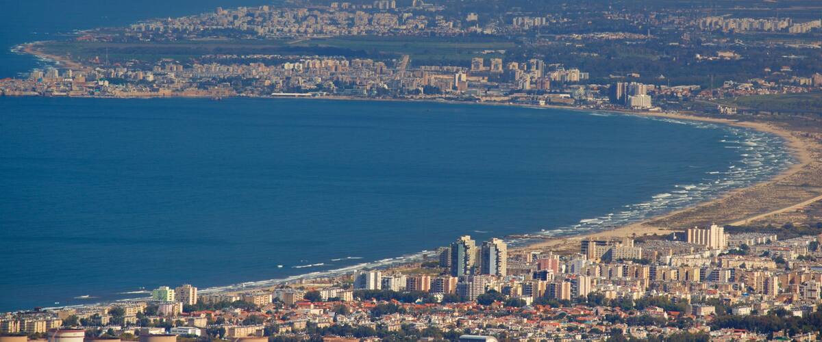Mount Carmel which includes landscape views, a coastal town and general coastal views