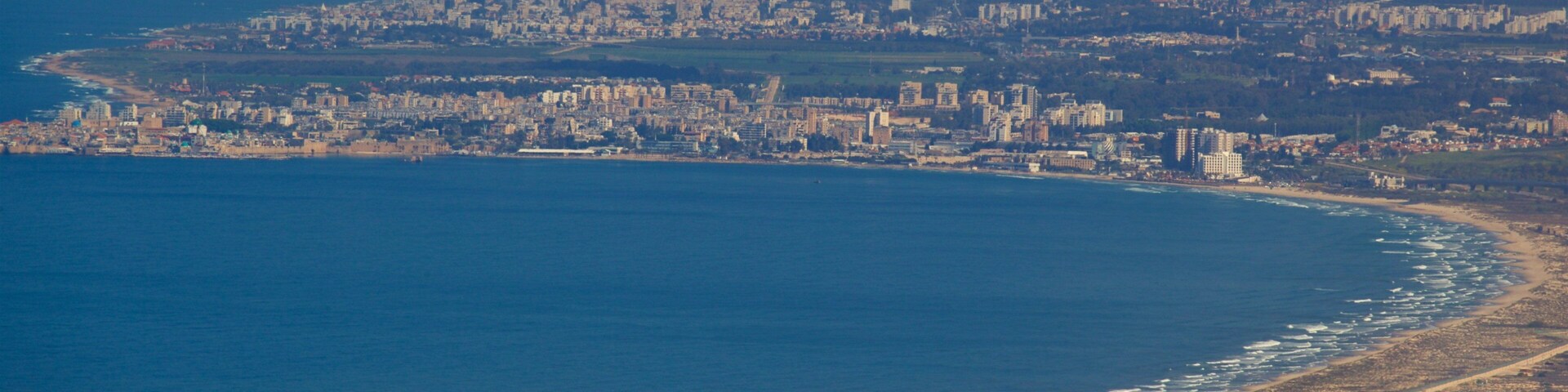 Mount Carmel which includes landscape views, a coastal town and general coastal views