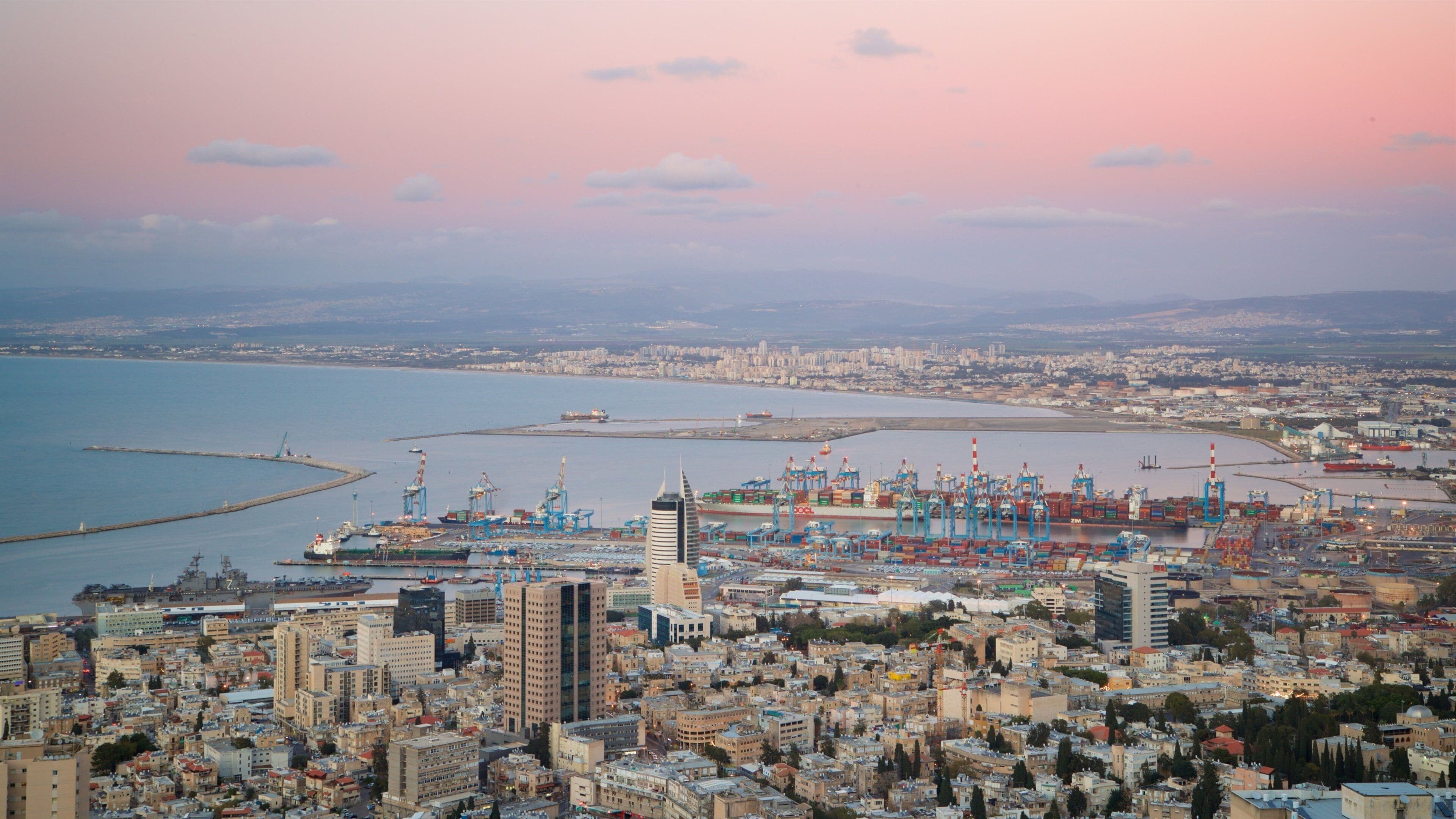 Haifa Port showing landscape views, a city and a sunset