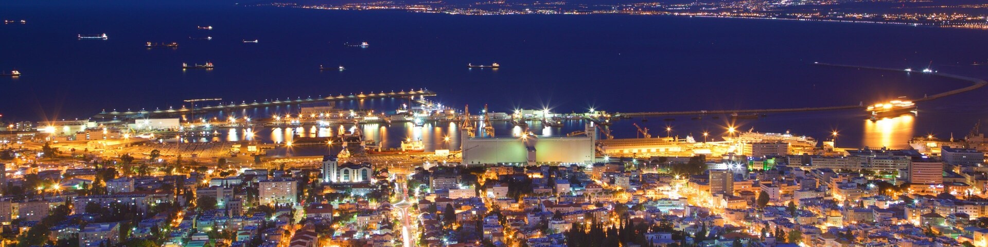 Haifa Port which includes a city, landscape views and night scenes