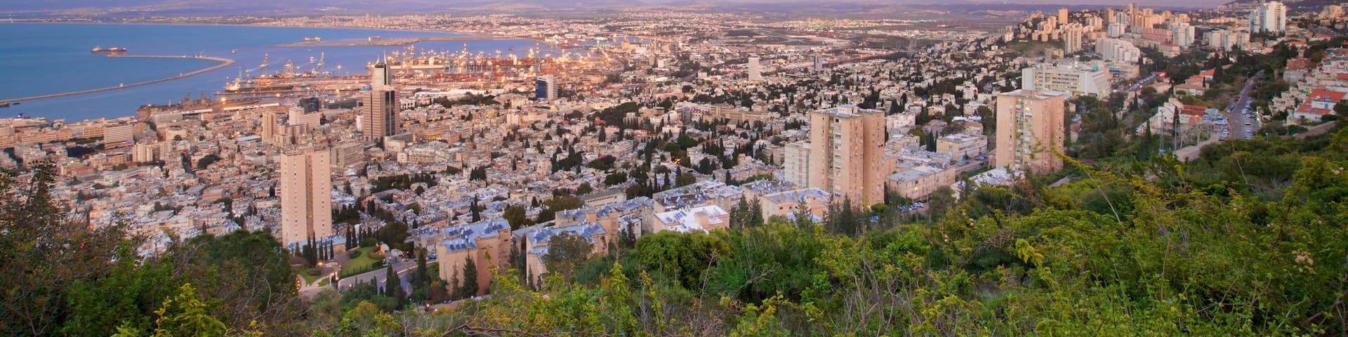 Haifa Port showing landscape views, a sunset and a city