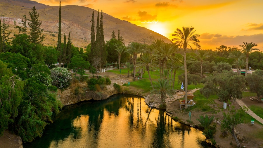 Aerial view of the sunset over Sachne or Gan Hashlosha oasis, with popular waterfall in Northern Israel