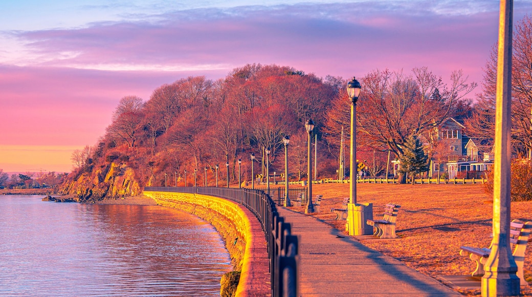 New England Seascape in New Haven Harbor in Connecticut at Sunrise: A tranquil beachfront along the Pardee Seawall Park