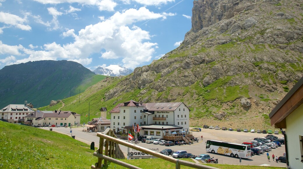 Trentino which includes a small town or village and mountains