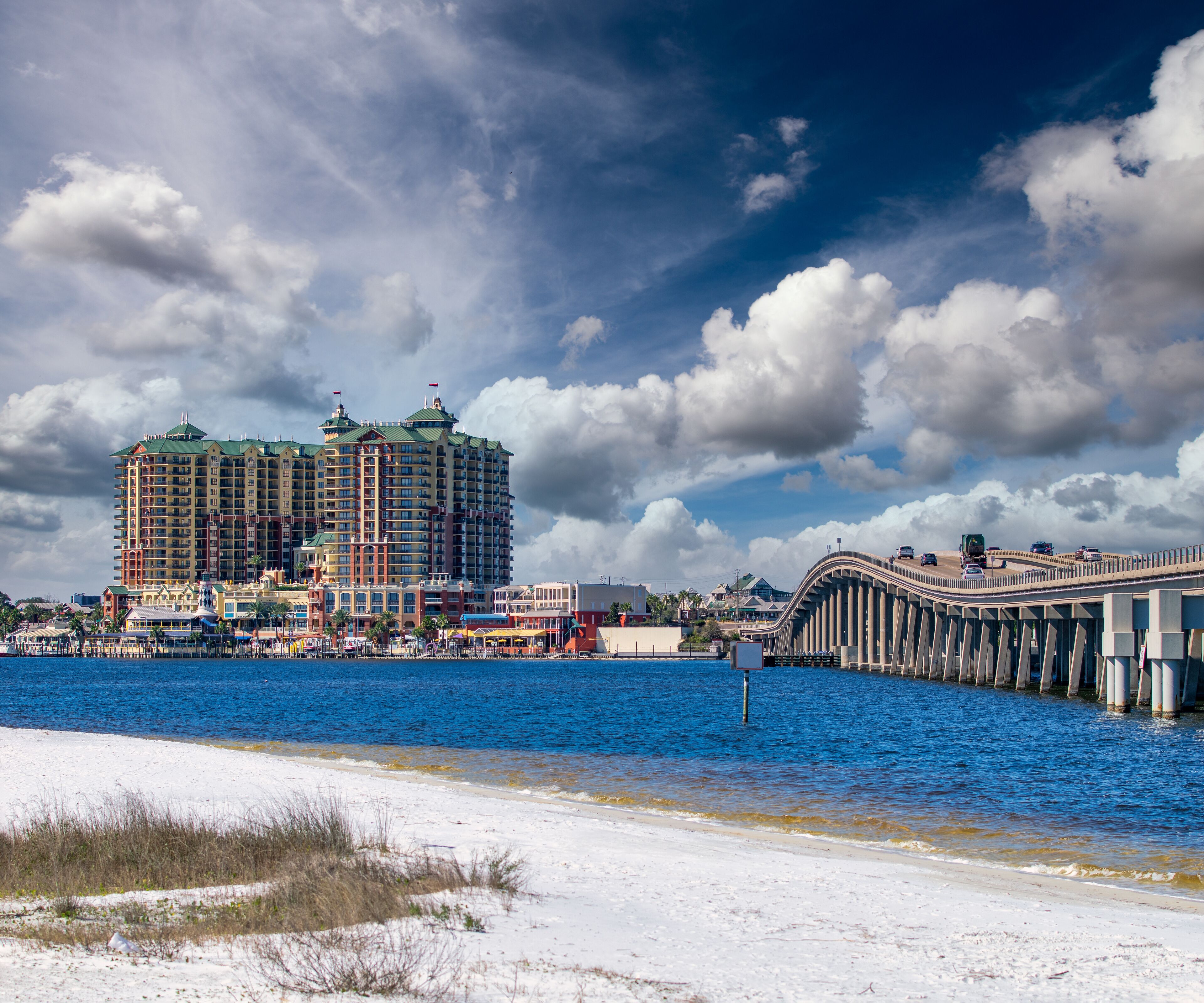 Bridge to Destin and city hotels under a sunset winter sky, Florida.