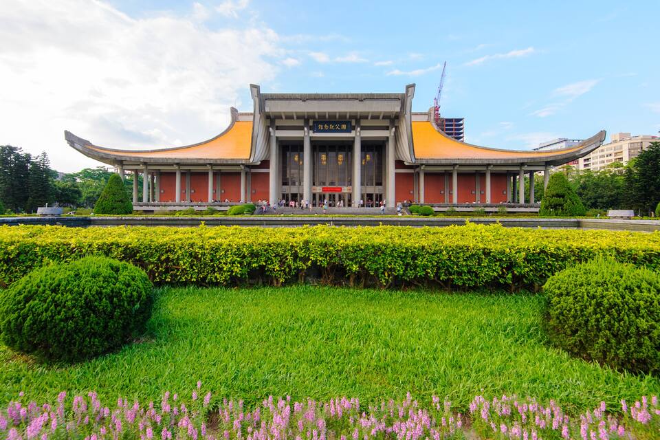 A traditional building with a curved roof and a large entrance.