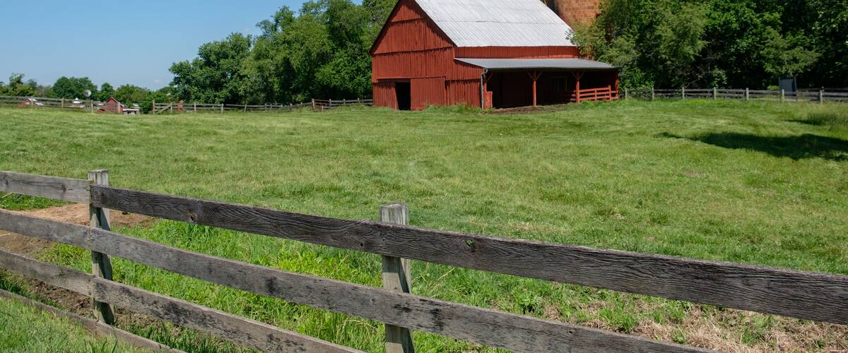 Barn and pasture with old wooden fence