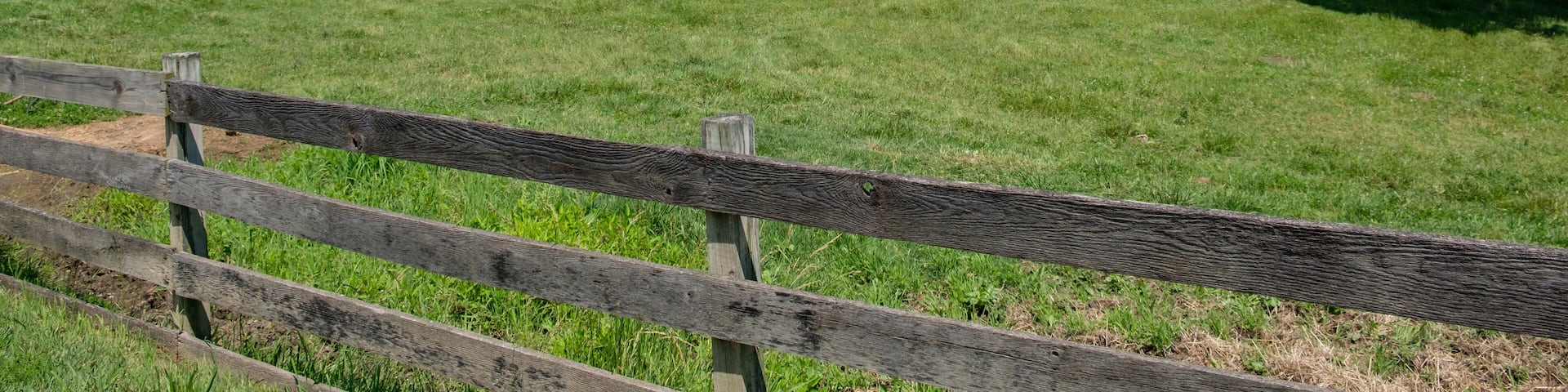 Barn and pasture with old wooden fence