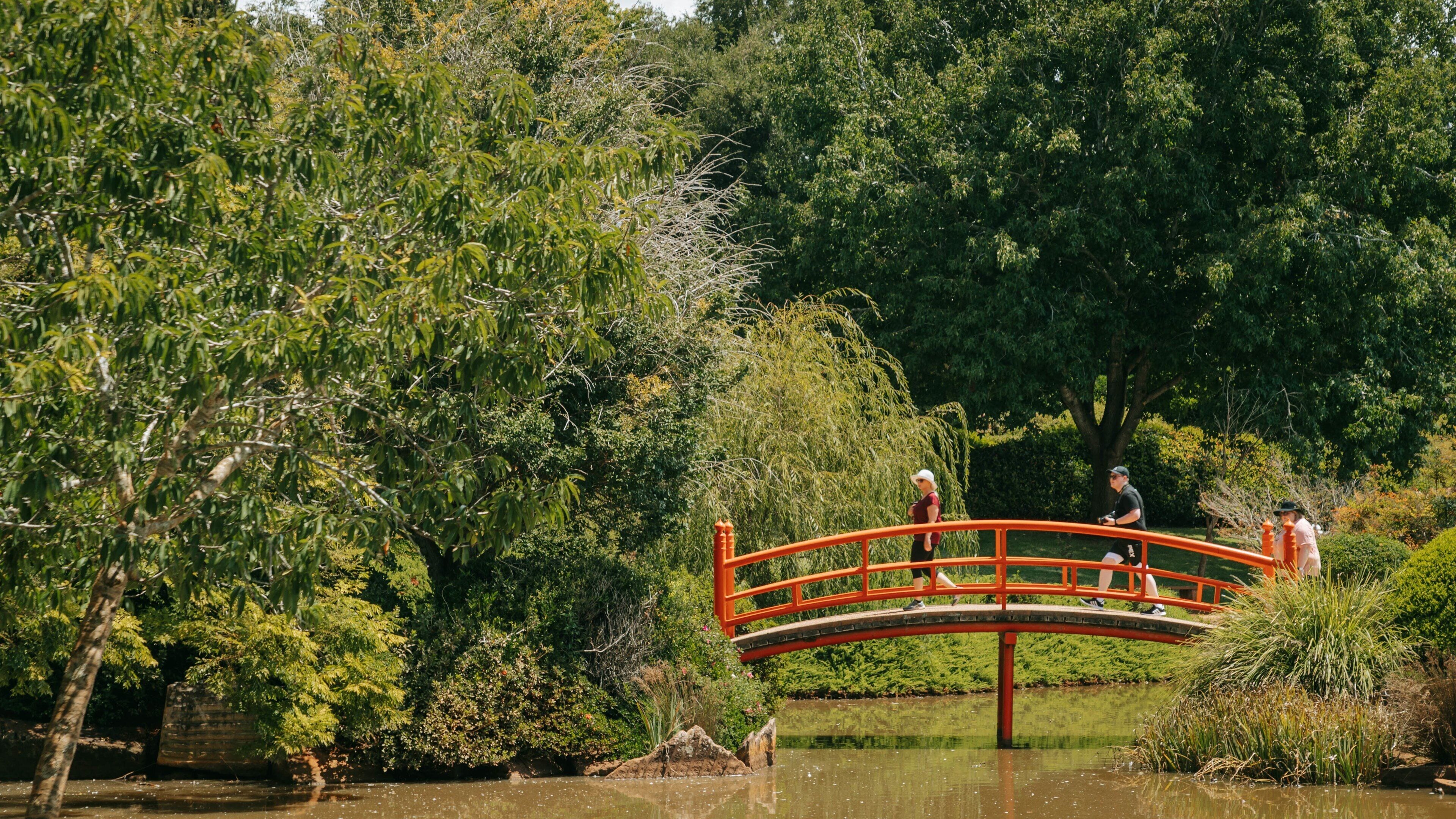 St Maarten and St Martin which includes a pond and a bridge as well as a small group of people