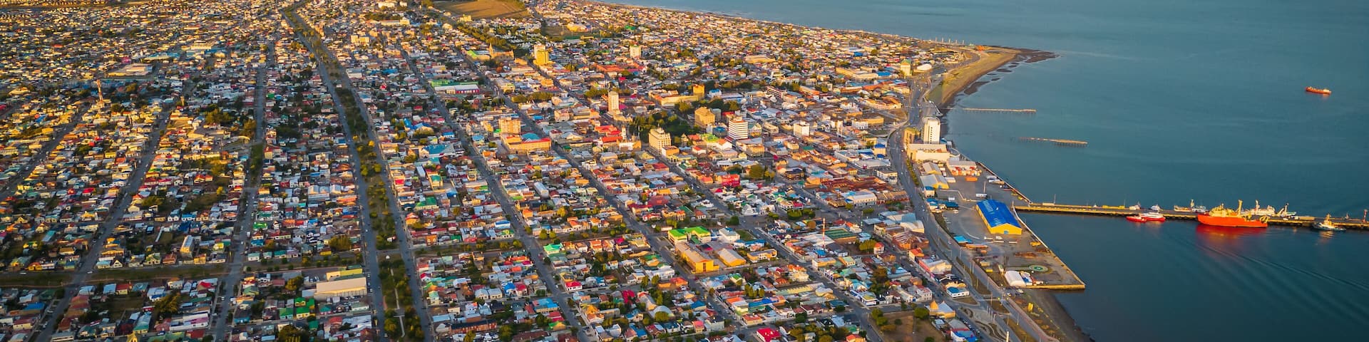 Aerial Drone Fly Above City of Punta Arenas Chile, Panoramic Cityscape in Summer Clear Sky, Ocean, Beautiful Port Town in Patagonia