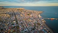 Aerial Drone Fly Above City of Punta Arenas Chile, Panoramic Cityscape in Summer Clear Sky, Ocean, Beautiful Port Town in Patagonia