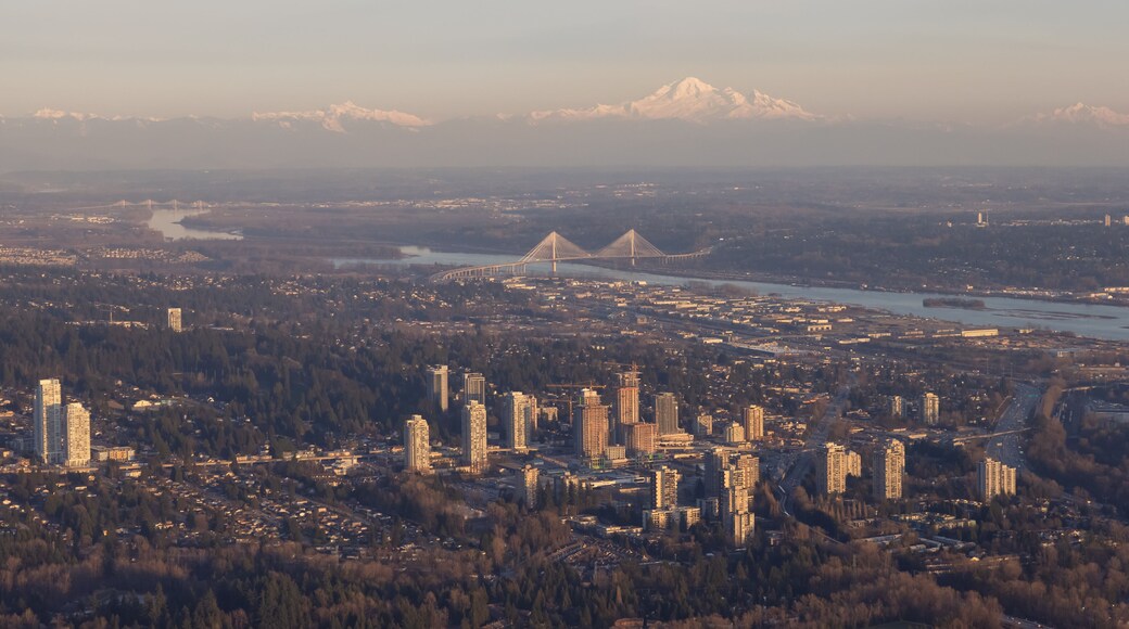 The City of Lougheed Shopping Centre in Burnaby, Greater Vancouver, British Columbia, Canada. Aerial View from Airplane. Port Mann Bridge and Mnt Baker in background.
