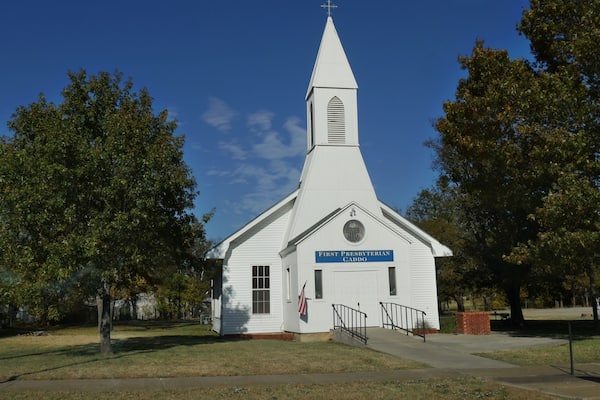 Façade of the First Presbytherian Church in Caddo, Oklahoma seen from the roadside