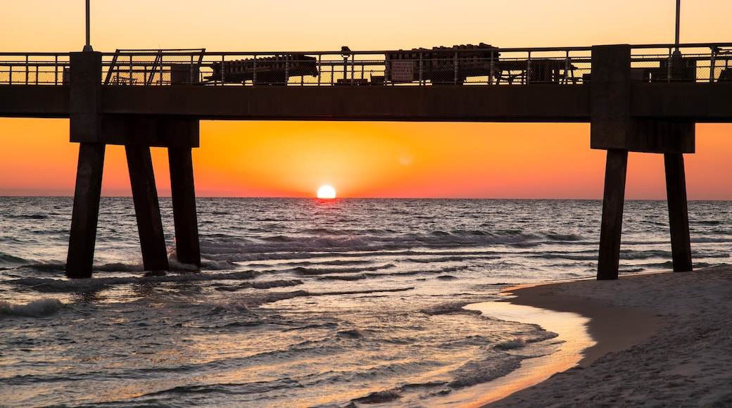 Okaloosa Island Pier which includes general coastal views, a sunset and a bridge