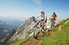 German Alps, Karwendel, young couple mountain biking