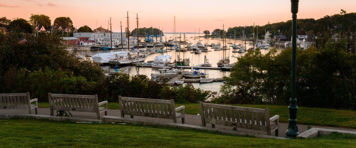 Empty Wooden Benches Facing a Scenic Harbour at Twilight. Camden, ME, United States