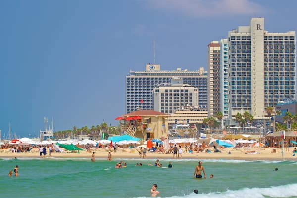 Jerusalem Beach showing a city, a beach and swimming