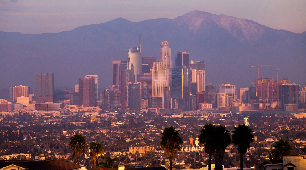 Kenneth Hahn State Recreation Area which includes a city, landscape views and a sunset