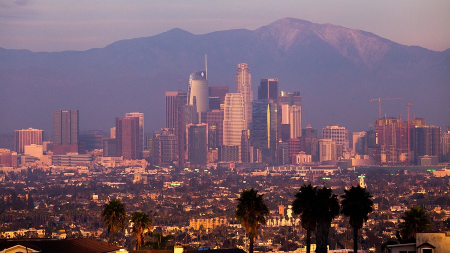 Kenneth Hahn State Recreation Area which includes a city, landscape views and a sunset