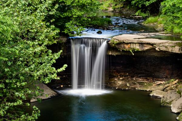 A beautiful creamy, milky waterfall with the motion frozen, nestled into a park in New Castle, Pennsylvania. Beauty in nature, landscape photography.