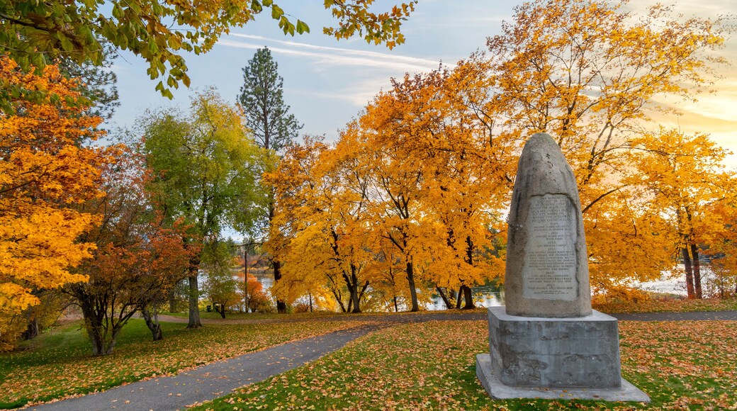 Late afternoon at Plantes Ferry park along the Spokane River with the monument to early settlers in view in Spokane, Washington, USA.