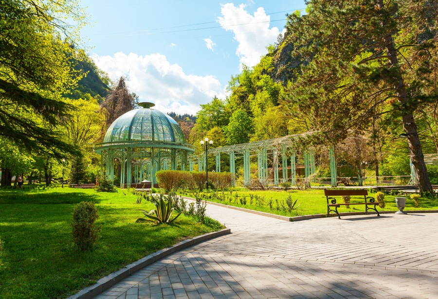 Borjomi Central Historical Park. Georgia. Source with healing mineral water. Beautiful pavilion with a glass dome.