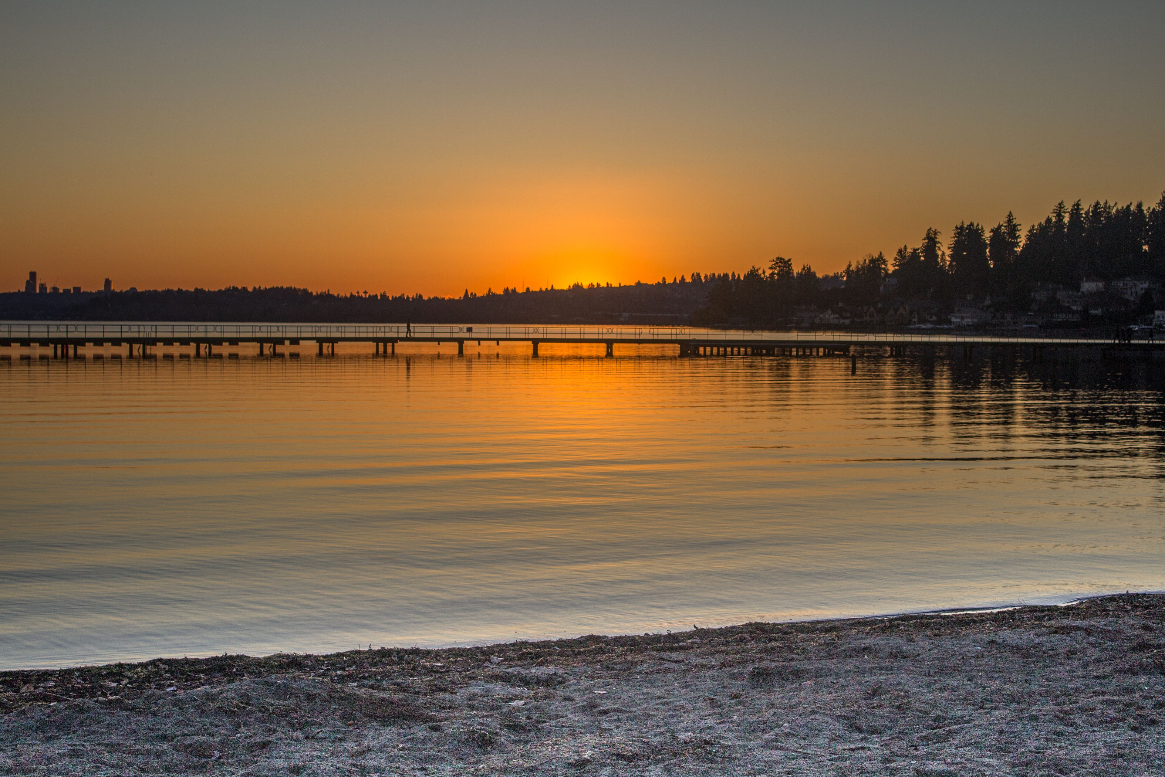 A view of a lake and pier in a winter sunset at Juanita Bay Park, Kirkland, Washington