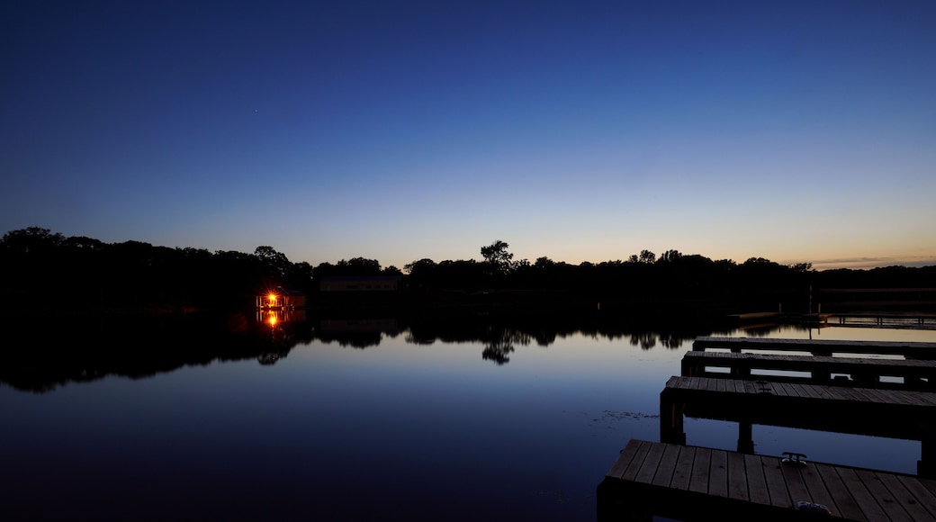 Lake Cabin on a calm lake at sundown