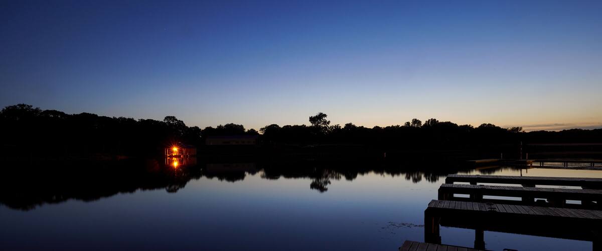 Lake Cabin on a calm lake at sundown
