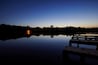 Lake Cabin on a calm lake at sundown