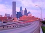 Houston Skyline at Sunrise Behind a Freeway Onramp
