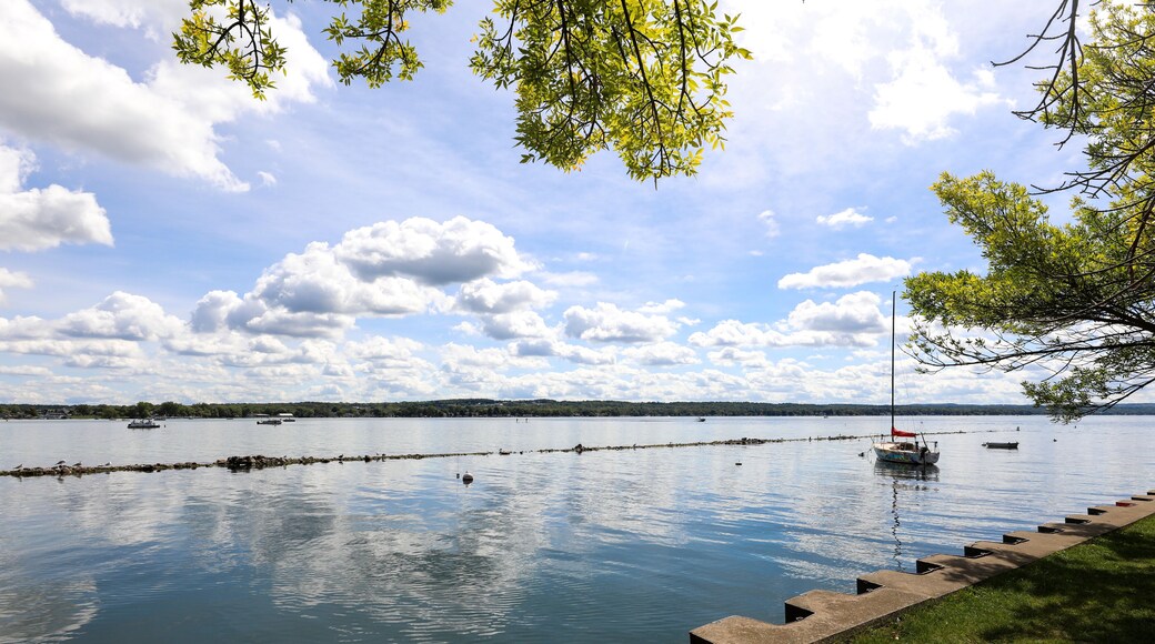 Sailboat on Canandaigua lake on a sunny summer morning. View from the Canandaigua, New York city pier