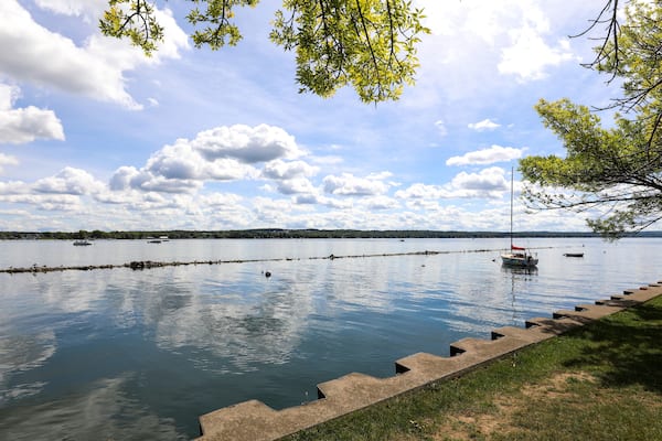Sailboat on Canandaigua lake on a sunny summer morning. View from the Canandaigua, New York city pier
