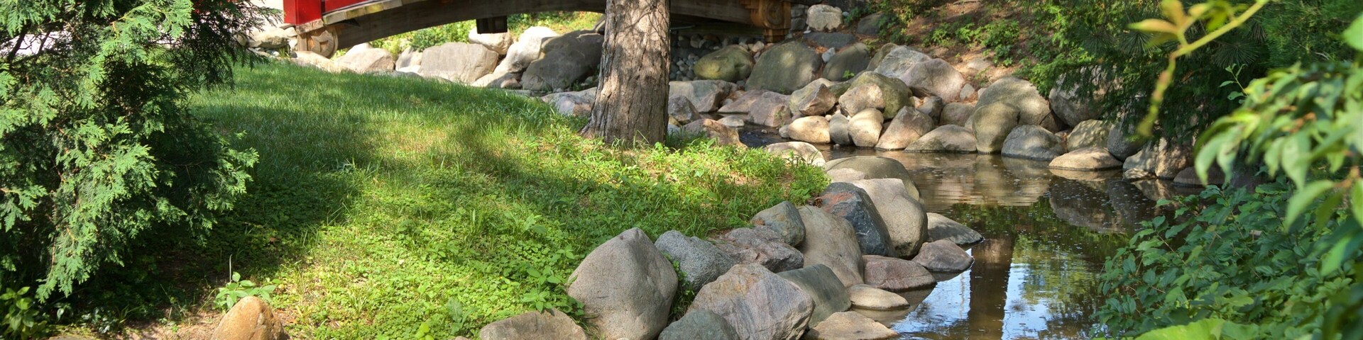 Japanese Cultural Center which includes a bridge, a park and a river or creek