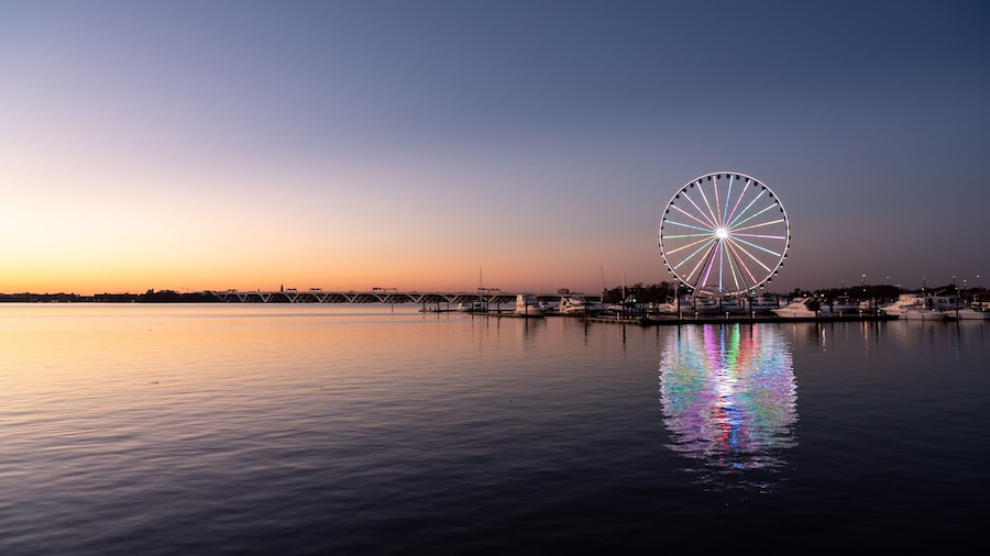 Illuminated ferris wheel at National Harbor near the nation capital of Washington DC at sunset