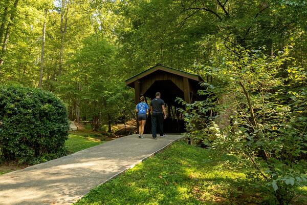 Wilshire Trails Park featuring a park and a bridge as well as a couple