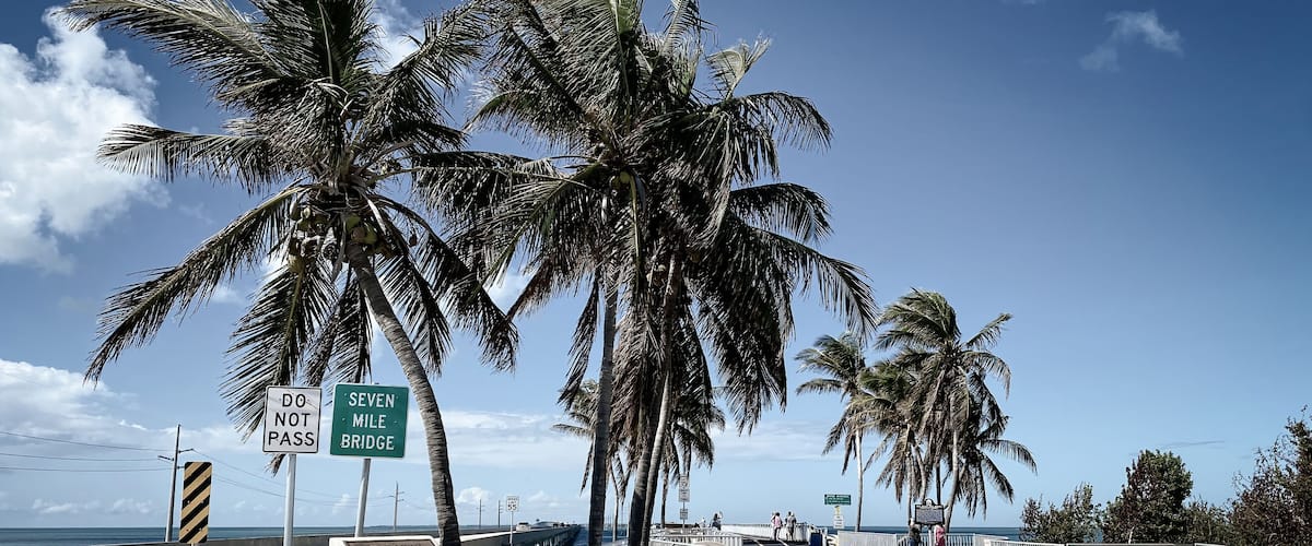 Begin of Seven Mile Bridge, Florida, USA with tourist information board.