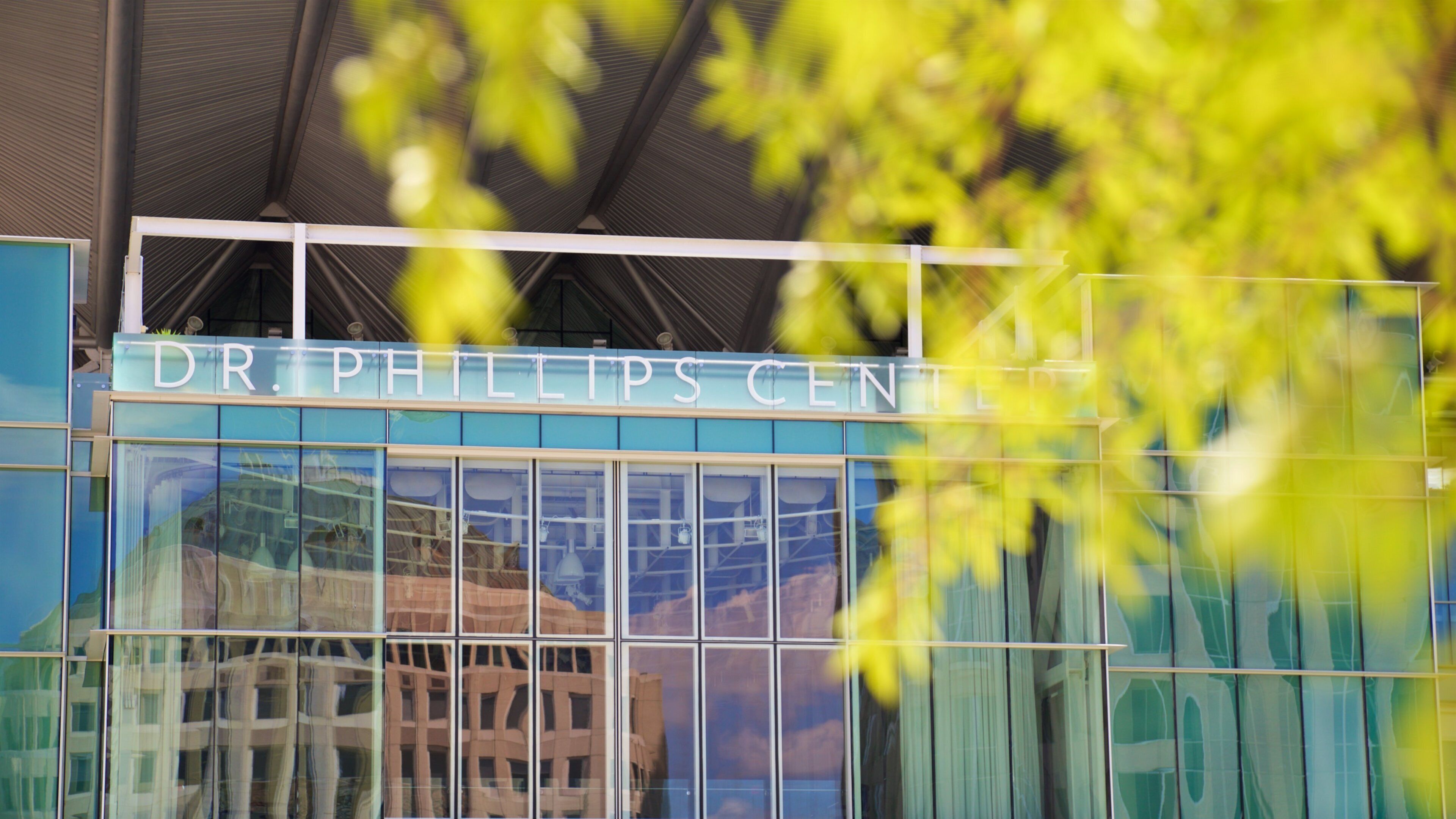 Dr. Phillips Center for the Performing Arts featuring signage and modern architecture