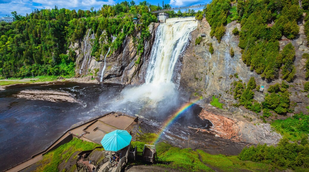 Landscape View of Montmorency Falls and Magnificent Rainbow in Montmorency Falls Park, Quebec, Canada