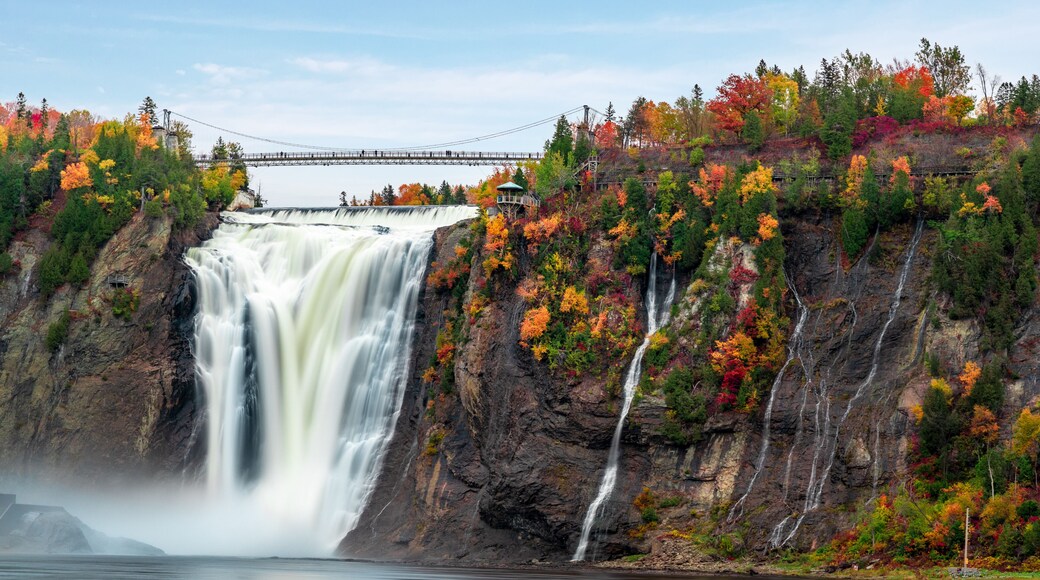 Montmorency Falls and Bridge in autumn with colorful trees